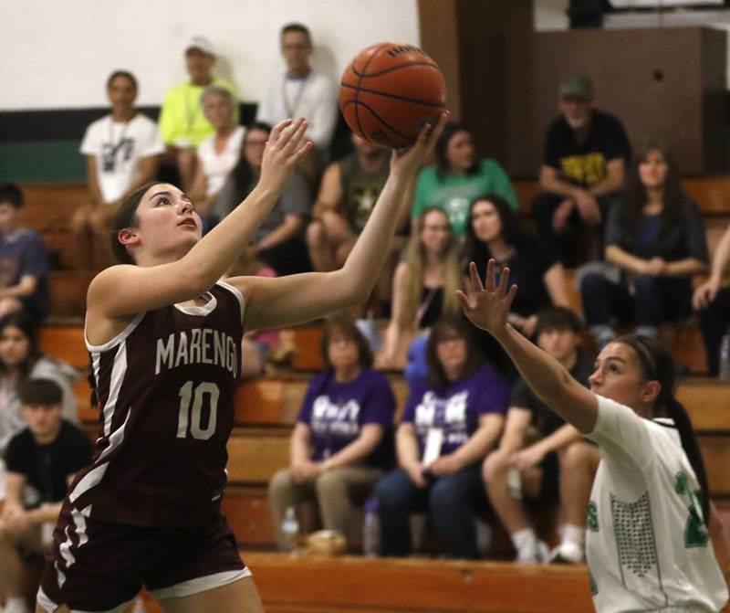 Marengo’s Bella Frohling drives to tree basketball in front of North Boone’s Payton Tuleynduring the girl’s game of McHenry County Area All-Star Basketball Extravaganza on Sunday, April 14, 2024, at Alden-Hebron’s Tigard Gymnasium in Hebron.