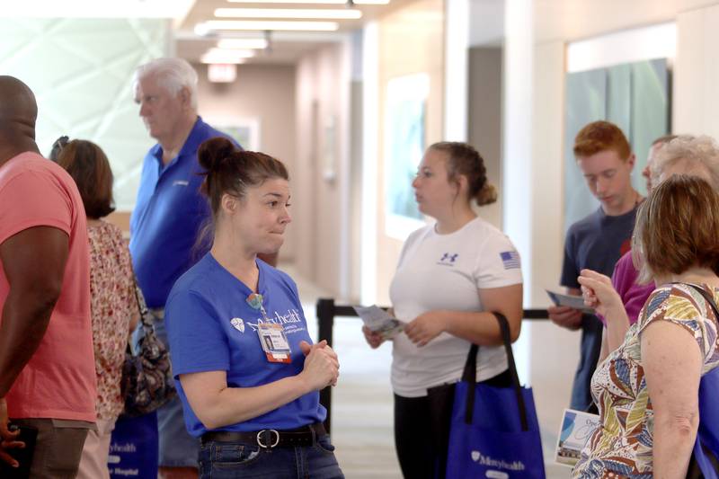 Nursing team lead Holly Peterson guides visitors during a public open house for the new Mercyhealth hospital in Crystal Lake on Saturday.