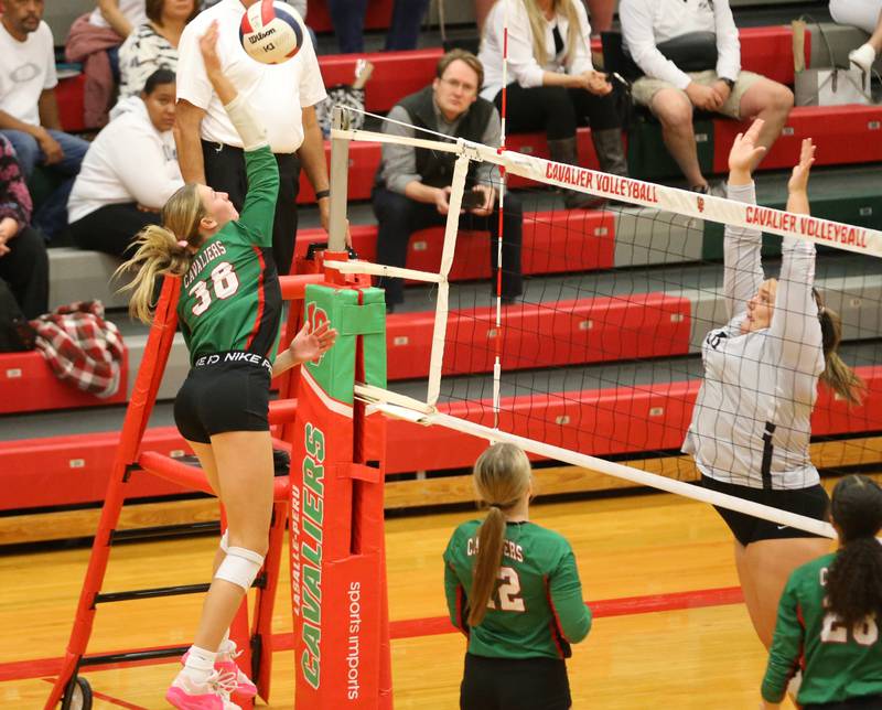 L-P's Aubrey Duttlinger sends a kill past Kaneland in AJ Sellett Gymnasium on Thursday, Oct. 24, 2024 at L-P High School.