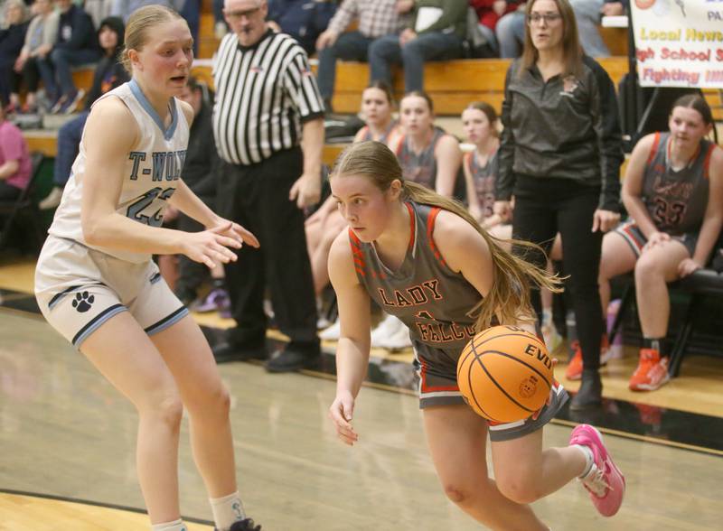 Flanagan-Cornell/Woodland's Ella Derossett works her way in the lane past Cissna Park's Josie Neukomm during the Class 1A Sectional semifinal game on Tuesday, Feb. 25, 2025 at Midland HIgh School.