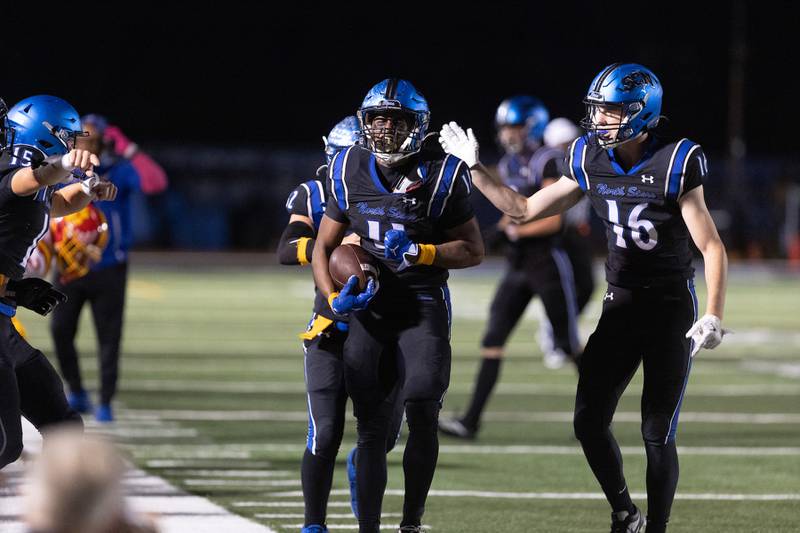St. Charles North's Christopher Akpede celebrates after a play against Batavia on Friday, Sept. 26, 2025 in St. Charles.