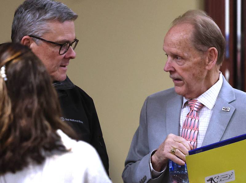 Second Ward Alderman candidate Michael Embrey (right) talks to attendees Wednesday, Feb. 19, 2025, at the DeKalb Area Rental Association and DeKalb Area Builders Association Candidate Night at Faranda's Banquet Center in DeKalb.