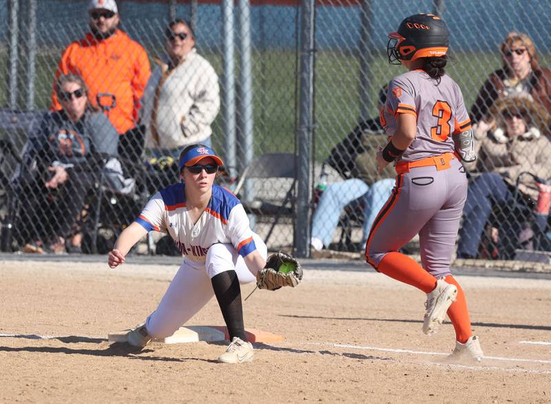 Genoa-Kingston's Lillian Provost stretches for the throw to record a force out on DeKalb's Emma Hart Thursday, May 8, 2025, during their game at Genoa-Kingston High School.