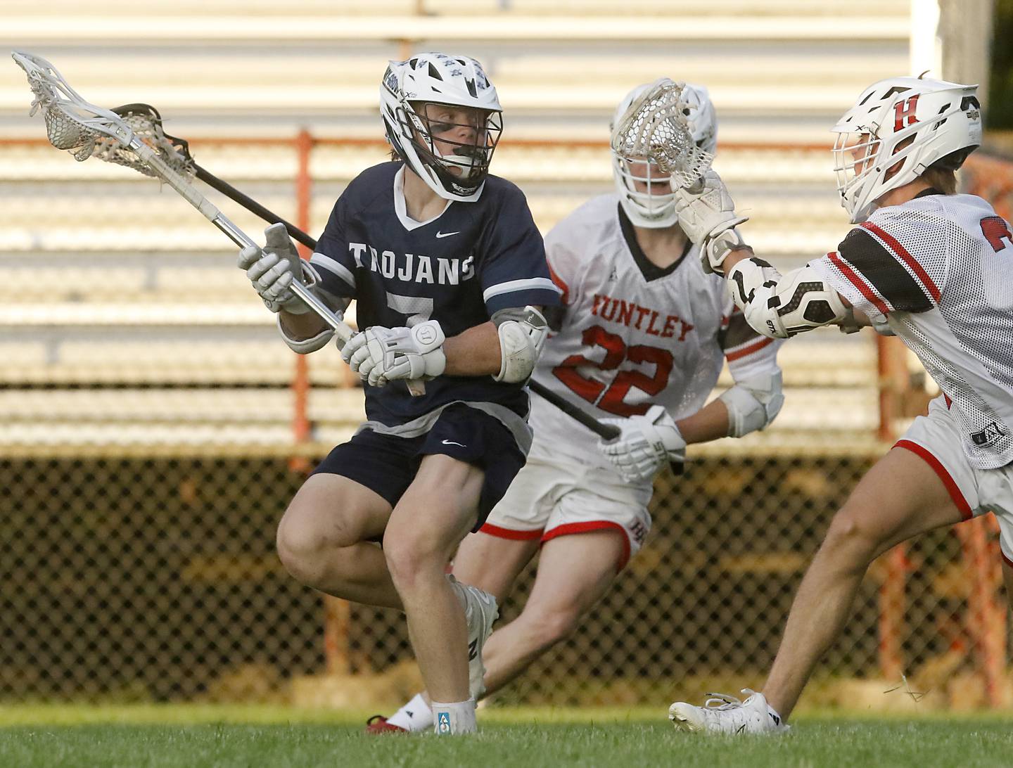 Cary-Grove's Taylor Allen looks too. Take a shot as Huntley's Austin Allegretti defends during the Marian Central Sectional boys lacrosse semifinal match on Wednesday, May 28, 2025, at Marian Central High School in Woodstock.