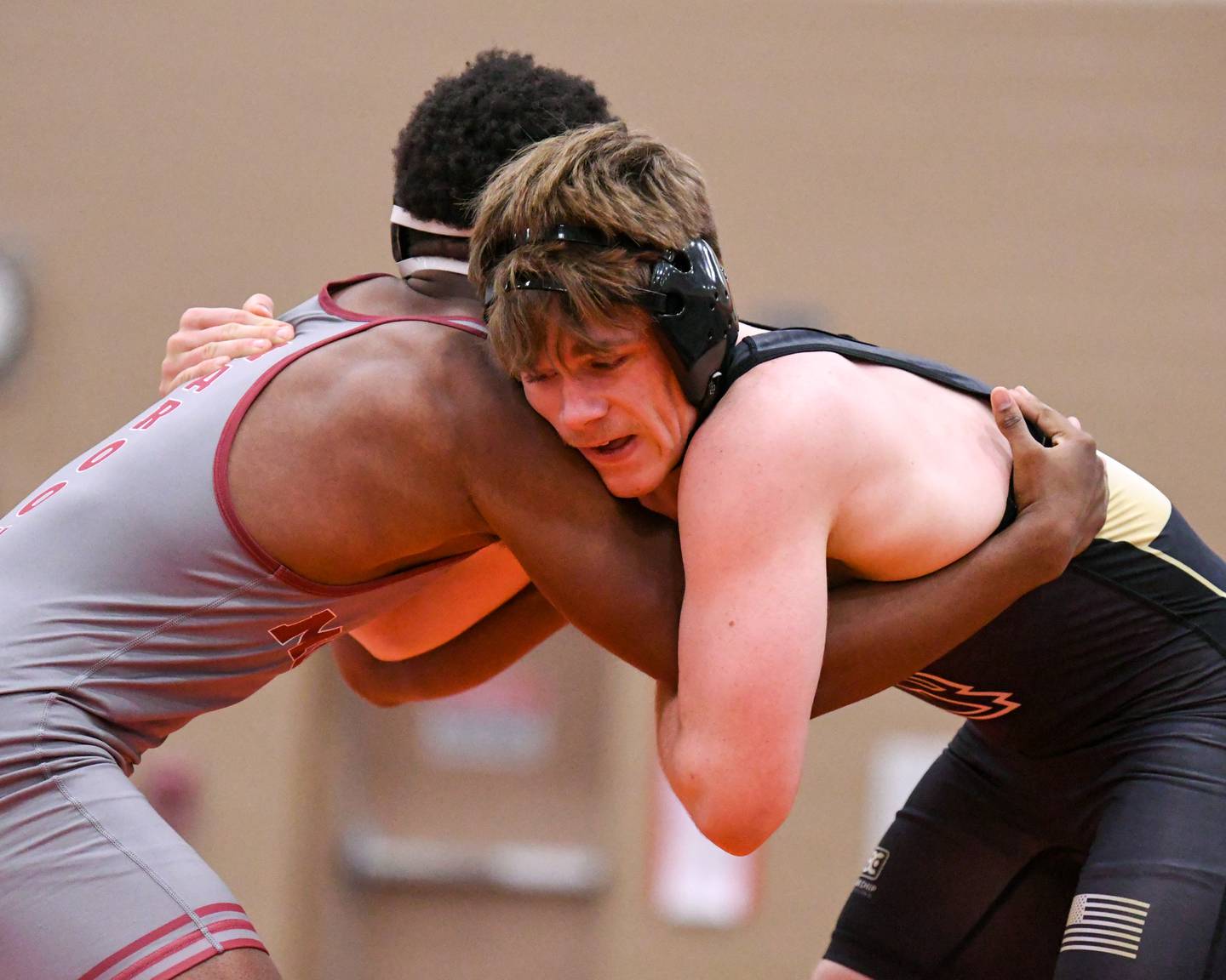Sycamore’s Douglas Gemberling, right, keeps a hold of Moline’s wrestler Alontae Goldsmith in the 157-weight class on Tuesday Dec. 30, 2025, during the flavin Invite held at DeKalb High School.