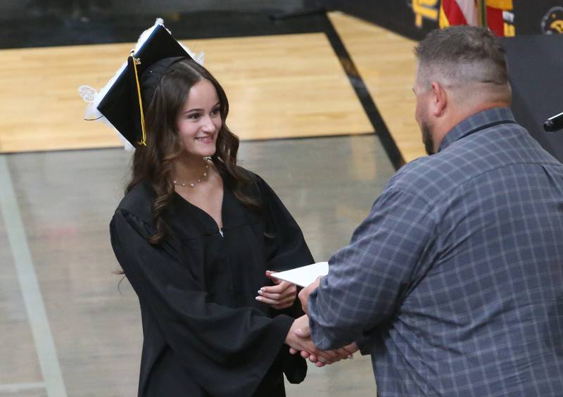 Putnam County High School graduate Madison Wasilewski, receives her diploma during the 59th annual Commencement on Sunday, May 18, 2025 in R.M. Germano gymnasium.