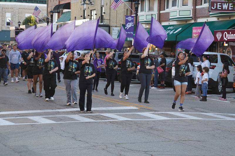 The RTHS flags team walks in the Rochelle Township High School Homecoming parade on Thursday, Sept. 25, 2025 in downtown Rochelle.
