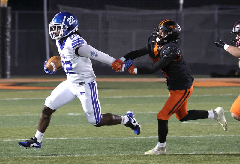Phillips' Wellington Hall pulls away from DeKalb's Kirk Johnson Friday, Sept. 5, 2025, during their game at DeKalb High School.
