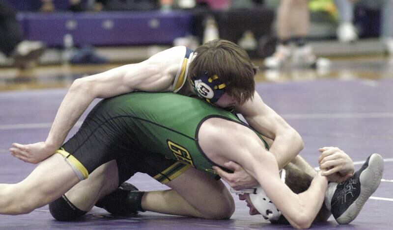 Sterling's Evan Jones wrestles Geneseo's Elliott Kreiner in the 113-pound third-place bout at the Class 2A Dixon Regional on Saturday, Feb. 8, 2025 at Lancaster Gym in Dixon.