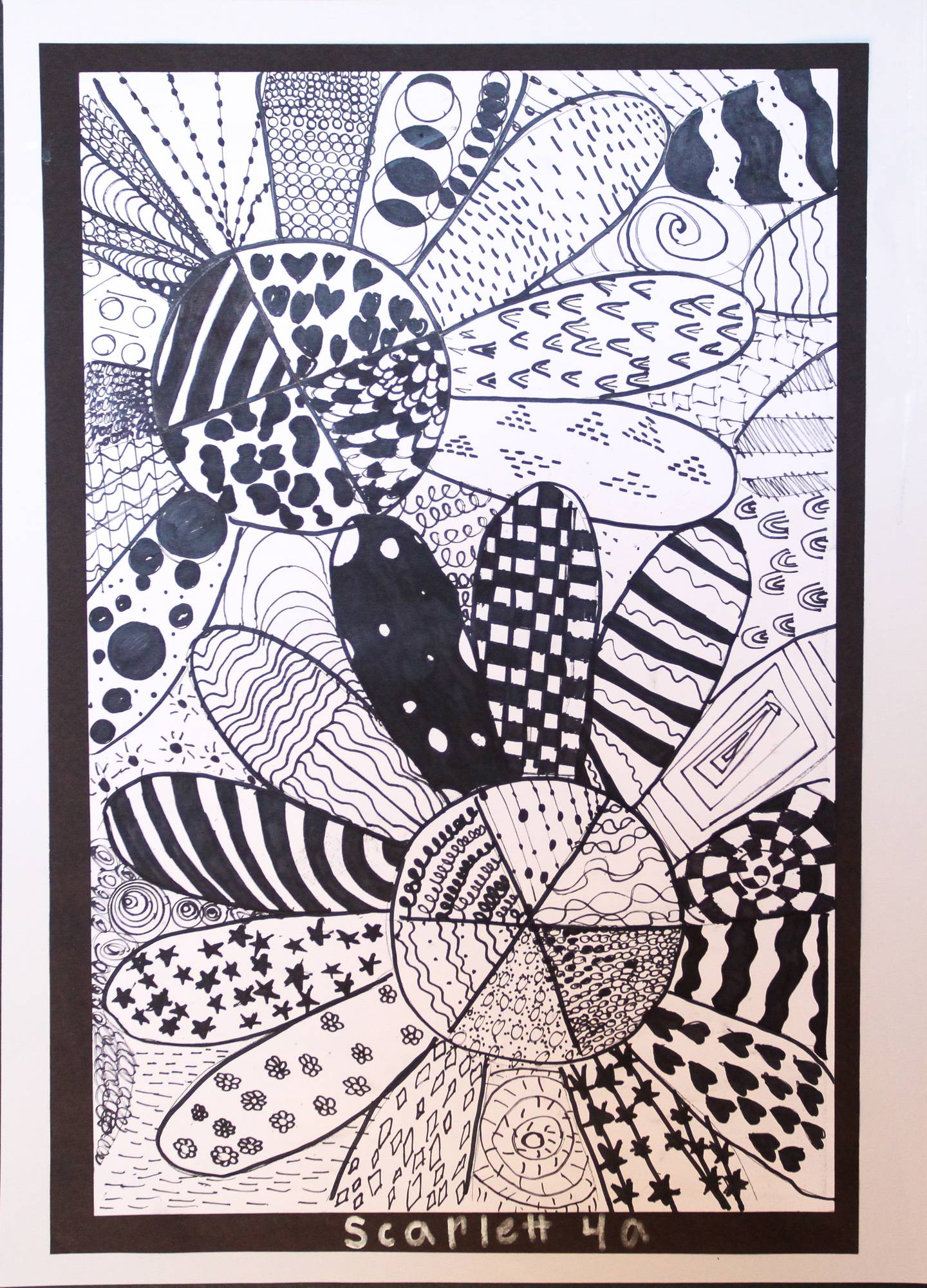 Scarlett S., a fourth grader at West Carroll Primary in Savanna, won first place in the K-4 category with her Sharpies piece called “Zentangle Flowers.”