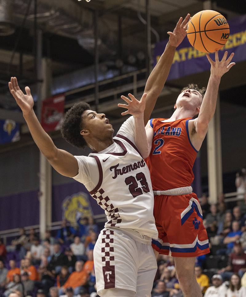 Eastland’s Wyatt Carroll is fouled by Tremont’s Brandon Tennon Monday, March 9, 2026, in the Class 1A Macomb Supersectional.