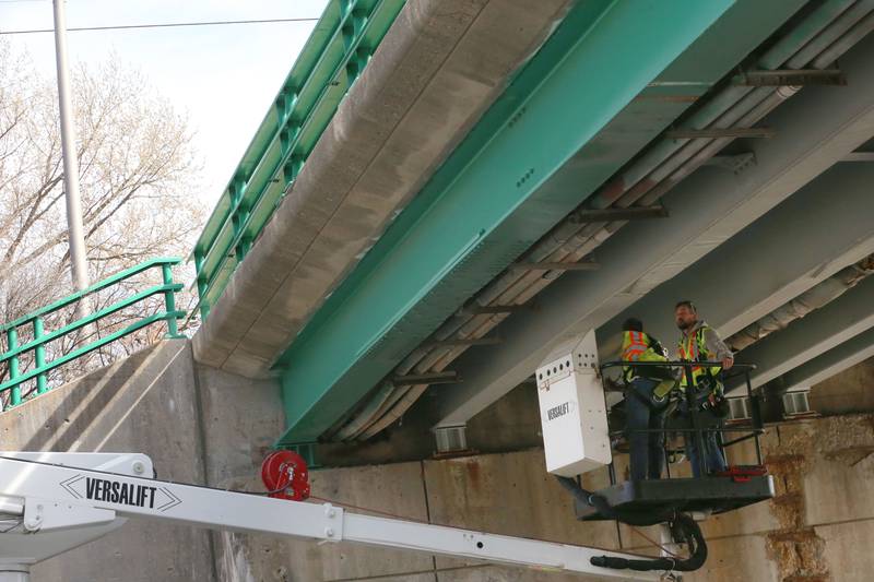 Illinois Department of Transportation crews inspect the 7th Street bridge over Illinois Route 251 after a semi struck it on Monday, March 10, 2025 in Peru. The semi was hauling two clamshell buckets for excavating equipment.