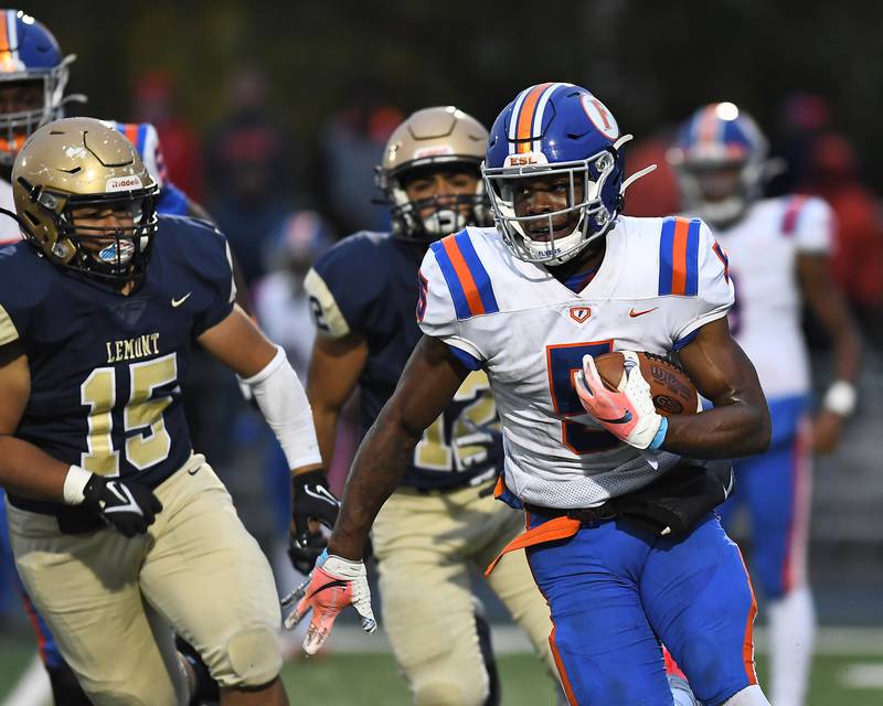 East St. Louis' Marquise Palmer (5) runs the ball during Class 6A quarterfinal playoff game on Saturday, Nov. 13, 2021, at Lemont High School.