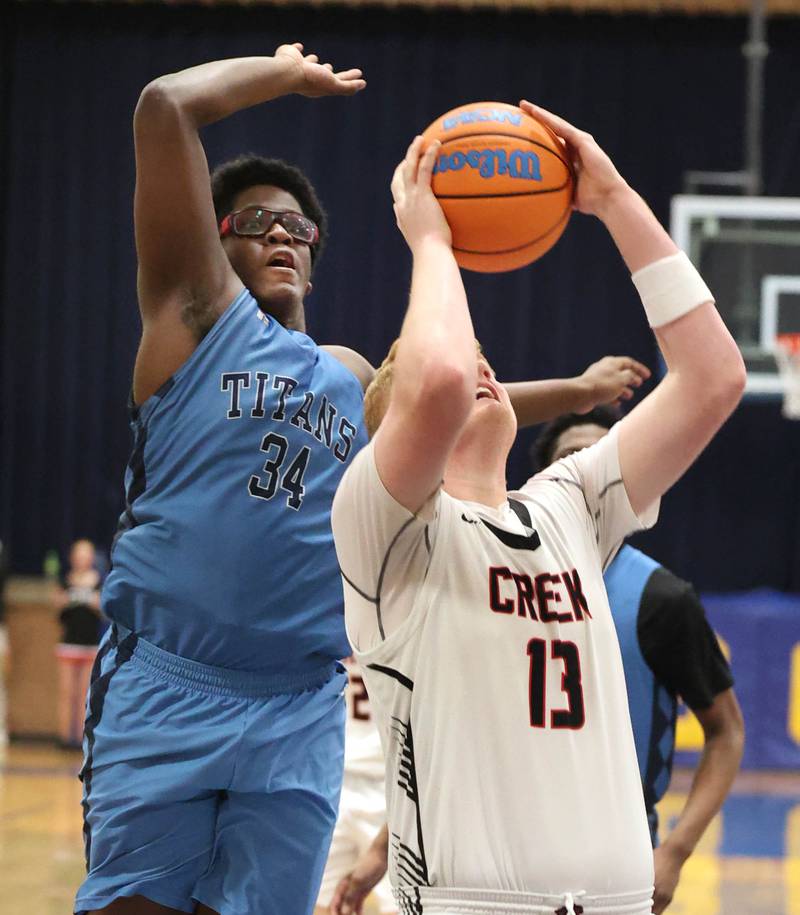 IMSA’s Lota Onwuameze blocks the shot of Indian Creek's Isaac Willis Friday, Feb. 6, 2026, during their Little 10 Conference championship game at Somonauk High School.