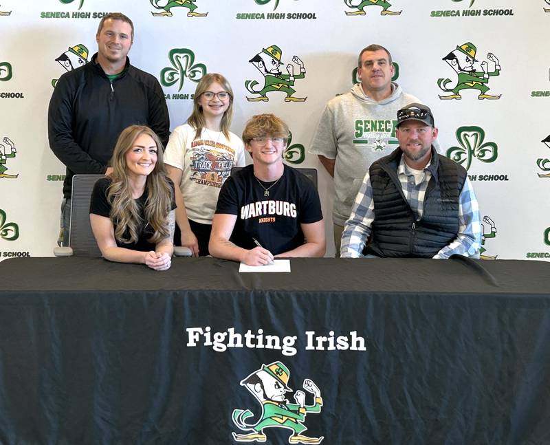 Recent Seneca High School graduate Brody Rademacher, the 2024 Times Football Player of the Year, has signed on to continue his education at Wartburg College in Waverly, Iowa, and his football career at the NCAA Division III level with the Knights. Pictured here at his signing ceremony are: in front – Celia Rademacher, Brody Rademacher, Shawn Rademacher; and standing – Seneca coach Terry Maxwell, Lilly Rademacher and Seneca AD Ted O'Boyle.