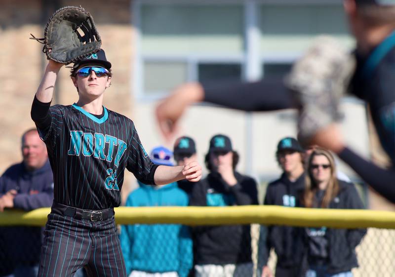 Woodstock North’s Parker Neff snags a toss to first for a force out against Prairie Ridge in Class 3A Regional baseball action at Cary Thursday.
