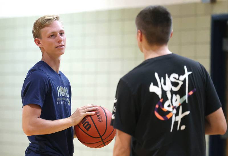 Hiawatha basketball head coach Matthew Montavon, who is heading into his second year at the helm, talks to one of his players during practice Thursday, June 13, 2024 at the school in Kirkland.