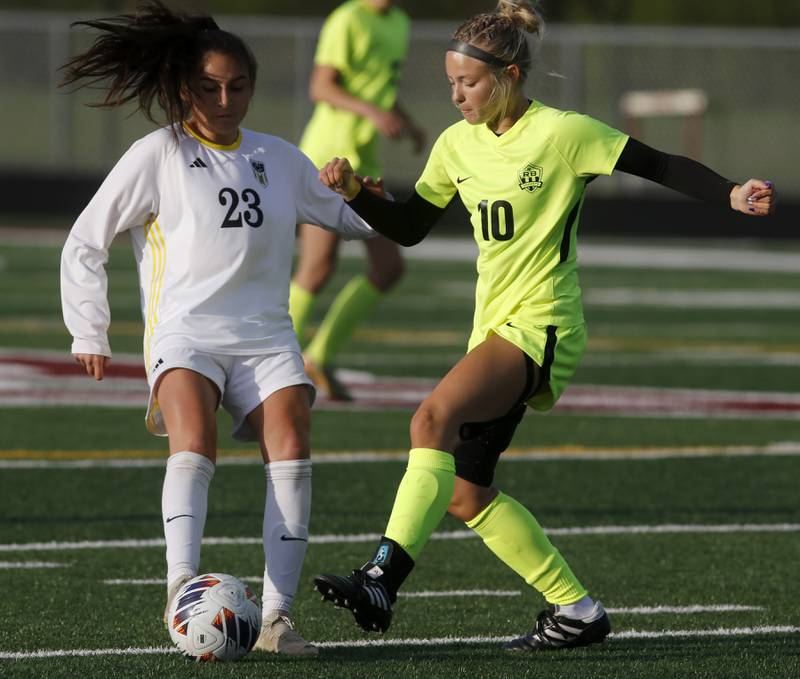Harvard's Julie Silva controls the ball in front of Richmond-Burton's Madelyn Seyller during the Kishwaukee River Conference Girls Soccer Tournament Championship Match on Wednesday, May 7, 2025, at HRichmond-Burton High School in Richmond.