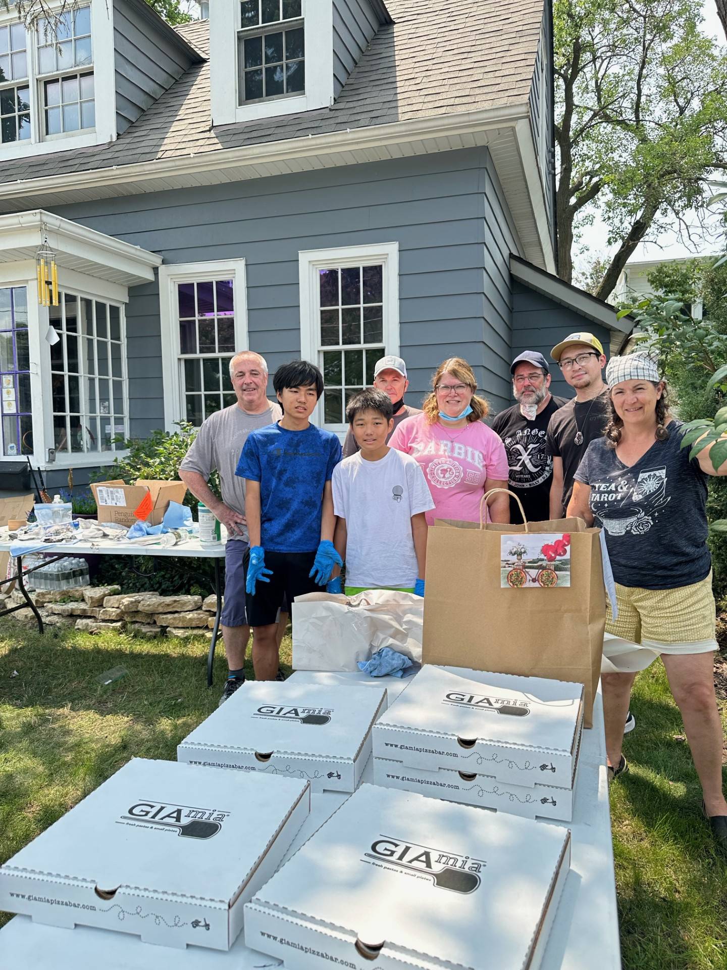 In a show of solidary, local Geneva businesses united to assist in the clean up following a fire at 
Monday, July 22, at a retail store, Pärla, 122 Hamilton St., Geneva. Gia Mia donated lunch. Volunteers are Tom Feltes, of The Royal Wren, (left), Jake and Sean Wong, sons of co-owner Max Won Cravings; Chuck Osborne, co-owner of Harvey’s Tales; Shari Ralish, former owner of Peaceful Parlour; Jeremy Pena of Crystal Life Technology; and Kristen Cornelio of Kristen Holley LLC.