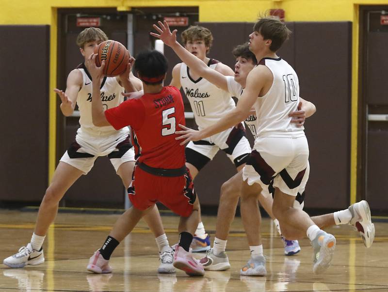 South Elgin’s Victor Sison to bring the ball up the court against Prairie Ridge's Drake Tomasiewicz. James Muse, Ben Gablenzand, and Cade Collins during a Hinkle Holiday Classic basketball game Tuesday, Dec. 27, 2022, at Jacobs High School in Algonquin.
