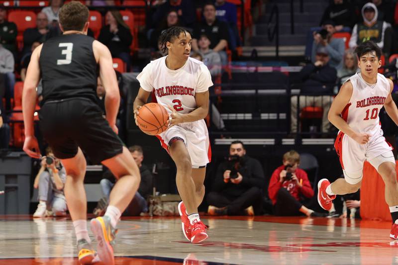 Bolingbrook’s Jayin Dunlap looks to pass against Glenbard West in the Class 4A semifinal at State Farm Center in Champaign. Friday, Mar. 11, 2022, in Champaign.