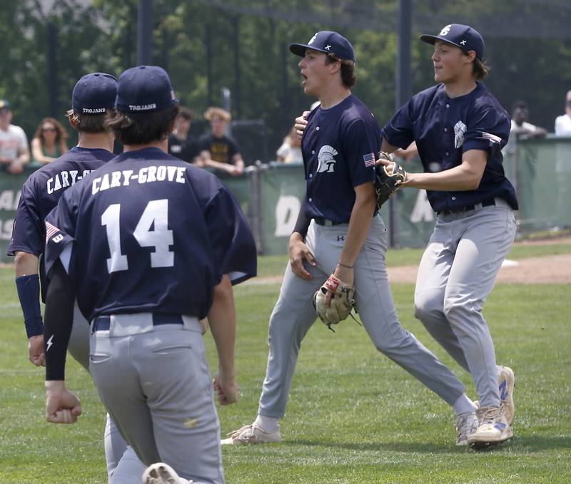 Cary-Grove's Kaden Norman (center) celebrates Cary-Grove’s win over Crystal Lake South in the IHSA Class 3A Grayslake Central Sectional Championship baseball game against Cary-Grove on Saturday, June 7, 2025, at Grayslake Central High School.