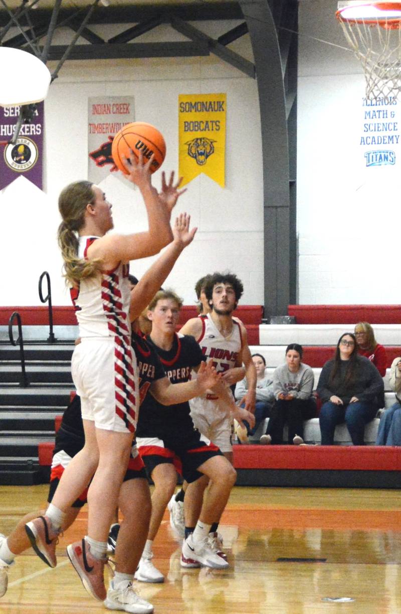 LaMoille's Jayden Brockhum takes aim Saturday against Amboy at Dean Madsen Gymnasium.