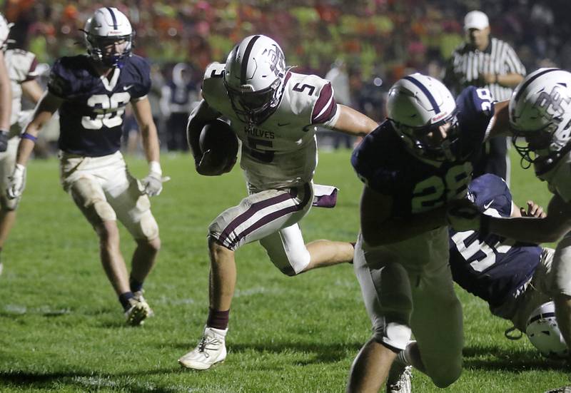 Prairie Ridge's Joseph Vanderwiel scores a touchdown win the fourth quarter to give Prairie Ridge the lead during a Fox Valley Conference football game against Cary-Grove on Friday, Sept. 22, 2023, at Cary-Grove High School in Cary.
