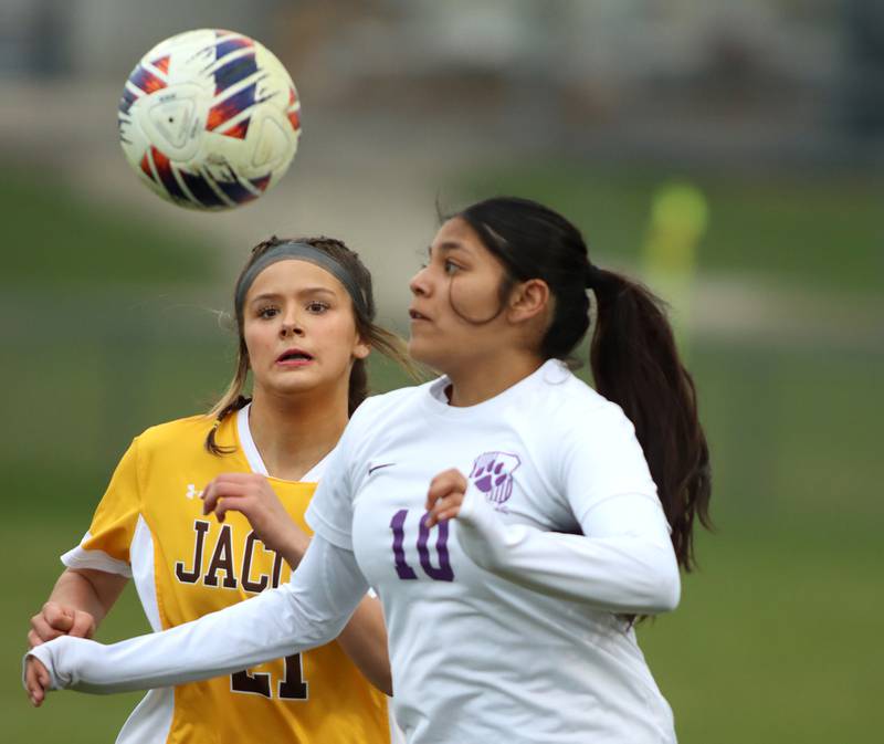 Jacobs’ Kylie Deegan, left, battles Hampshire’s Fabiola Martinez in varsity girls soccer on Thursday, April 17, 2025, at Jacobs High School in Algonquin.