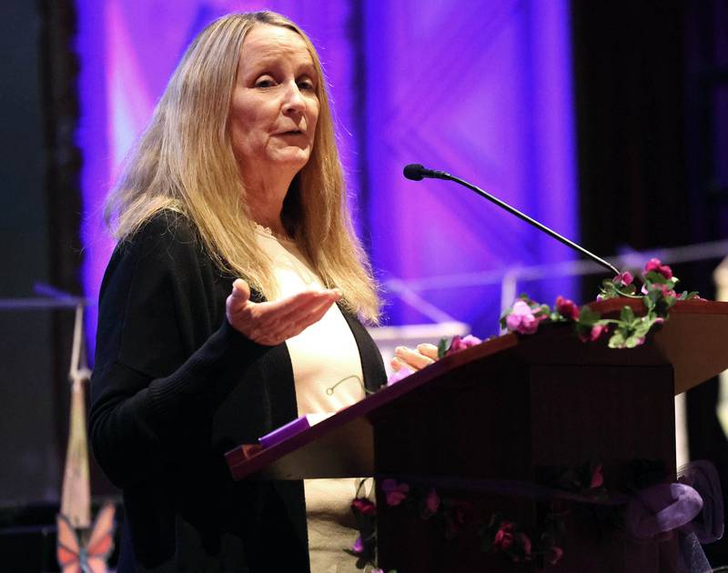 Jana Roe, a domestic violence survivor and activist, speaks during the Safe Passage Candlelight Vigil and Survivor Speak Out Monday, Oct. 6, 2025, at the Egyptian Theatre in DeKalb.