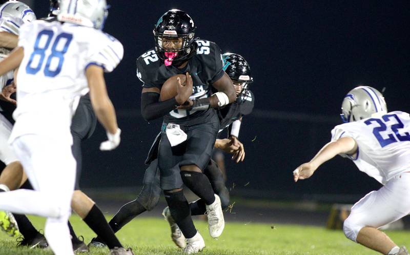 Woodstock North’s David Randecker runs the ball against Woodstock in varsity football at Woodstock North Friday night.