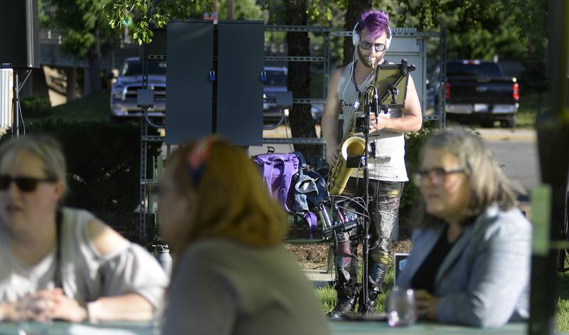 Lucas Sanor entertains on the saxophone while the crowd of wine lovers relaxes Friday, June 3, 2022, at Wine Fest in Ottawa. The festival runs through Sunday.