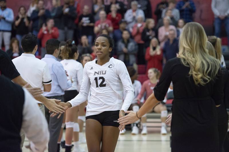 NIU volleyball player Jazmine Kemp enters the court prior to a 2019 game. The DeKalb grad and the Huskies play their first game since the 2019 season this weekend.