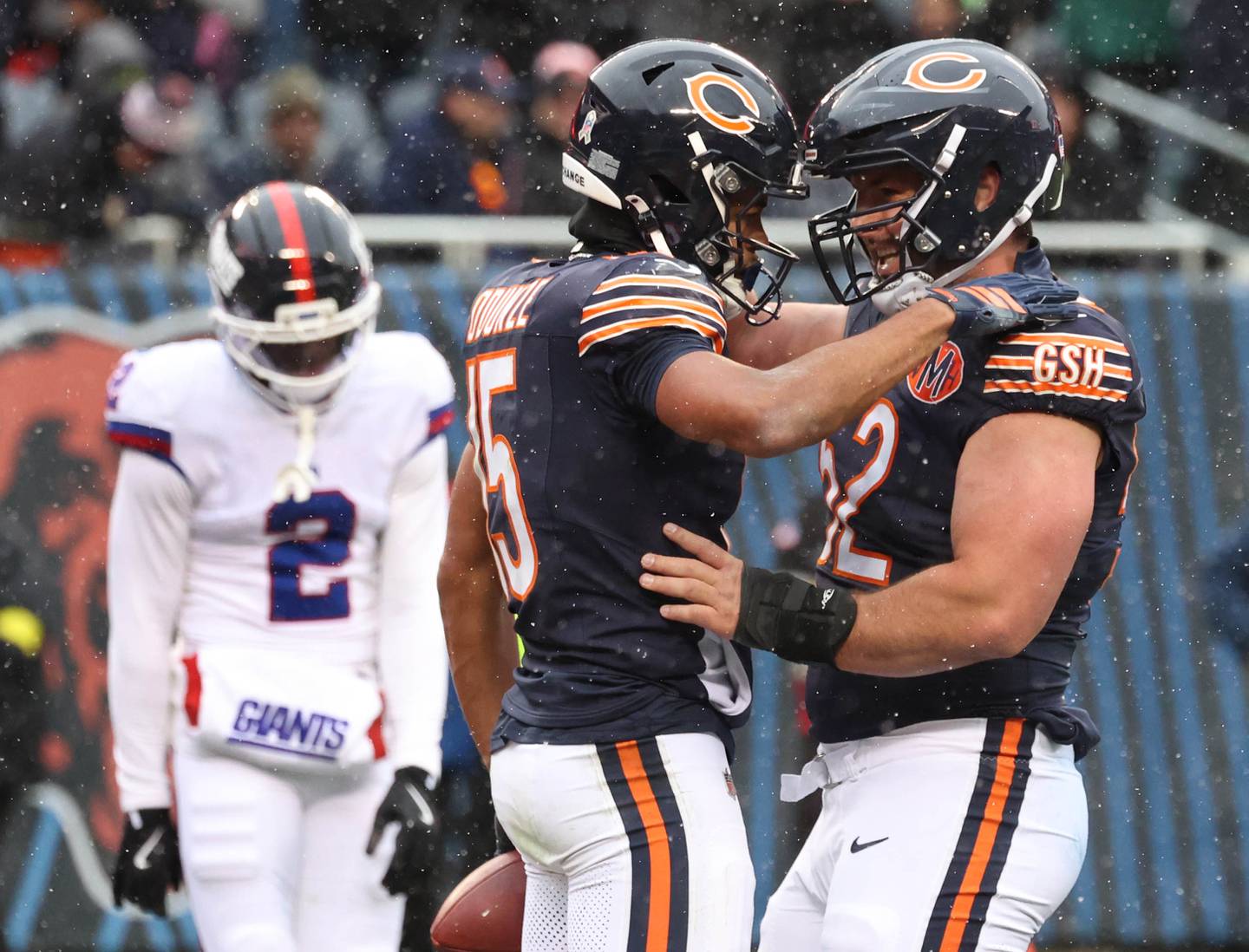 Chicago Bears wide receiver Rome Odunze (left) celebrates his touchdown catch with Chicago Bears center Drew Dalman Sunday, Nov. 9, 2025, during their game at Soldier Field in Chicago.