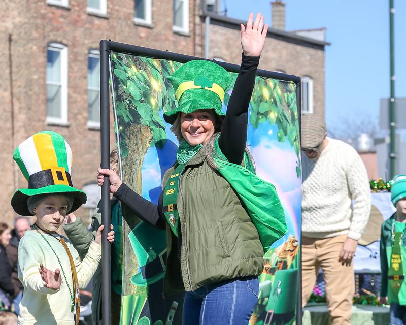 A participant waves from a float in the Lemont St. Pat's Day Parade on Saturday, March 8, 2025  in Lemont.