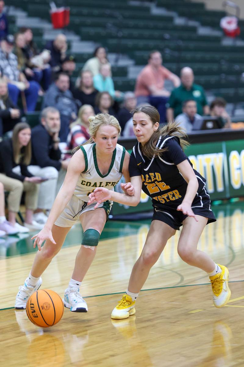 Coal City's Sydney Larson drives against a Reed-Custer defender during the Comets' 50-43 victory over Coal City on Monday, Jan. 11, 2026.