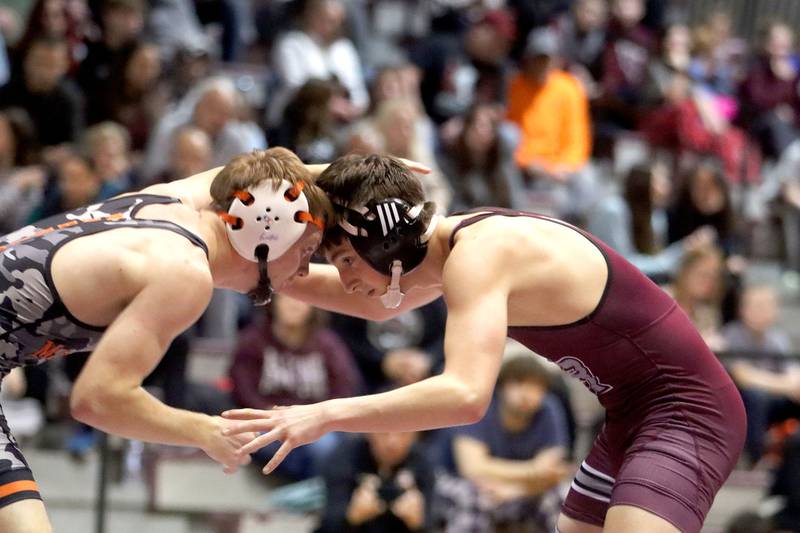 McHenry’s Nate Hunt, left, battles Prairie Ridge’s Lorenzo Massart at 132 pounds in varsity boys wrestling on Thursday, Jan. 8, 2026 at Prairie Ridge High School in Crystal Lake.