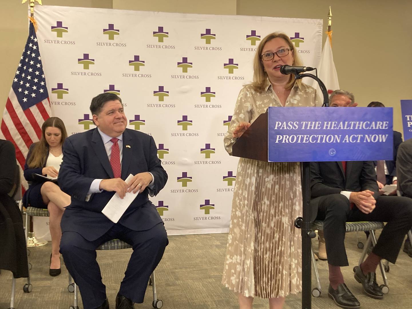 State Rep. Anna Moeller discusses the Healthcare Protection Act at a press conference with Gov. JB Pritzker at Silver Cross Hospital.