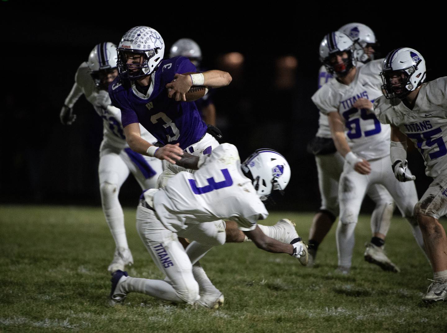 Wilmington's Ryan Kettman carries the ball on a play as El Paso-Gridley's Cha'von Maxon attempts a tackle in the Class 2A semifinal on Saturday, November 22, 2025.