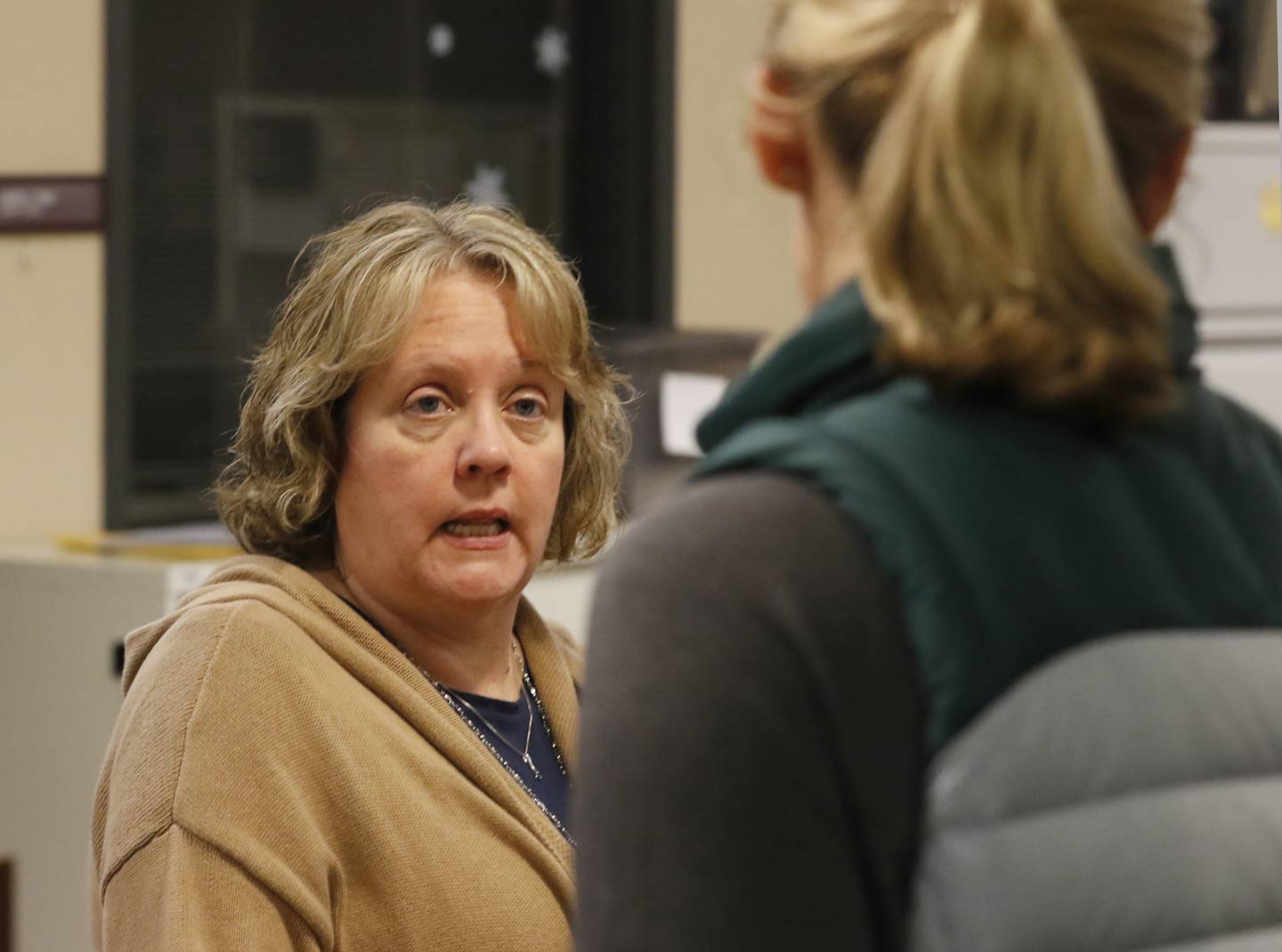 McHenry Deputy County Clerk Debra Nieto talks with Nicole Segura, who is running for the Prairie Grove School District 46 school board, as Segura files her candidate forms on Monday, Nov. 18, 2024, at the McHenry County Clerk's Office in Woodstock.  Monday was the final day of filing for the consolidated election on April 1, 2025.