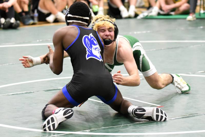 Coal City's Owen Petersen, right, shoots at Peotone's Jonah Young during the Illinois Central Eight Conference 126-pound championship at Coal City Saturday, Jan. 24, 2026.