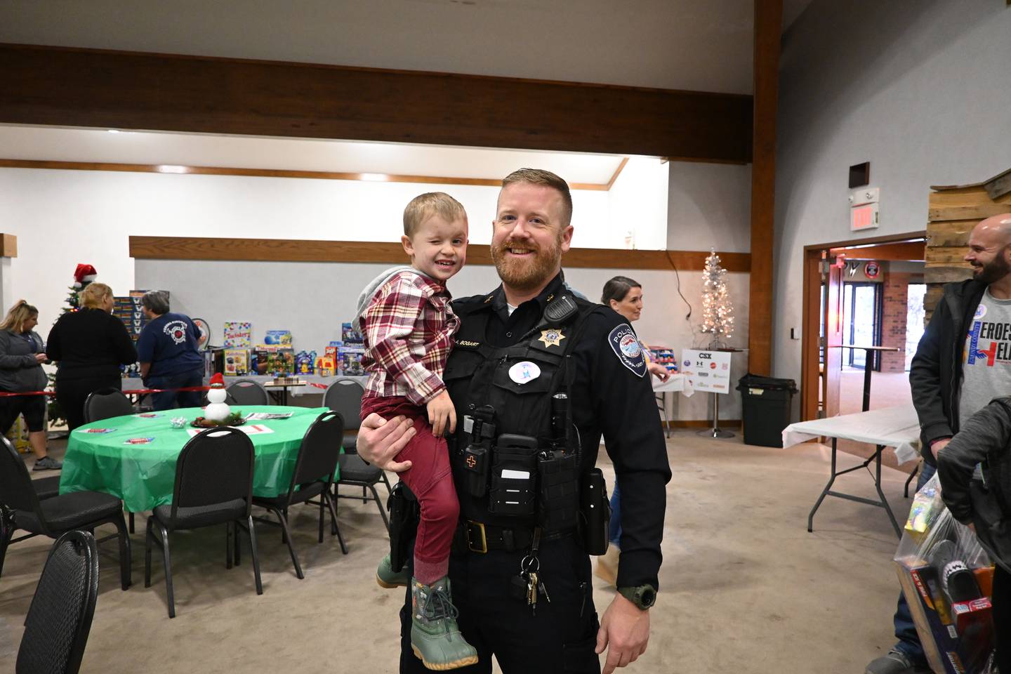 Deputy Chief Adam Bogart of the Channahon Police Department with Brentley during Grundy County's Heroes and Helpers event on Saturday.