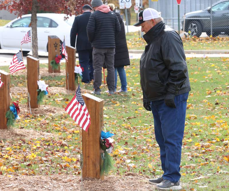 Aflred Huenebug pays tribute to family members who attended Hall High School that died in WWII during the Veterans Day program on Tuesday, Nov. 11, 2025 in the Hall High School