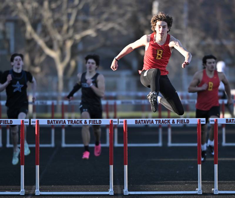 Batavia’s Thomas Woodard gets over the last hurdle to win his heat of the 300-meter hurdles at the Les Hodge Boys Track and Field Invitational at Batavia High School on Friday, April 5, 2024.