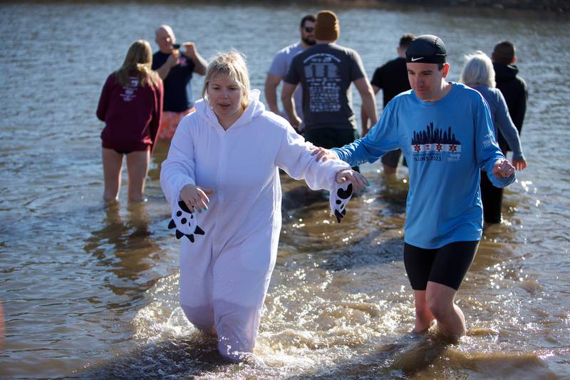 Locals take the plunge at the St. Charles Police and Fire Annual Polar Plunge at Ferson Creek Park on Sunday, March 9,2025 in St. Charles.