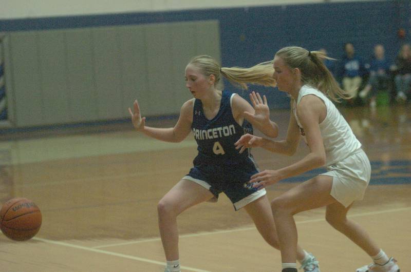 Princeton's Paige Jesse (4) takes a hands off approach as this ball goes out of ball in Saturday's championship game of the Princeton Holiday Tournament.