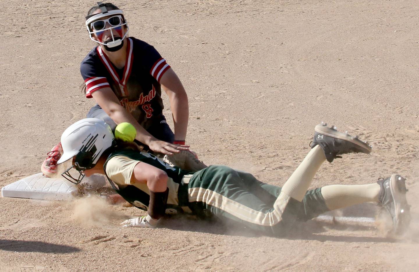 St. Bede's Emma Slingsby slides back into third base as Biggsvillle's Shelby Bowman in the Class 3A Sectional championship game on Friday, May 26, 2023 at St. Bede Academy.