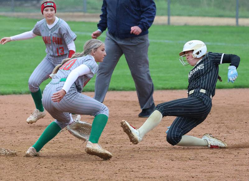 Sycamore's Callie Countryman slides safely into second base as LaSalle-Peru's Kelsey Frederick waits for the throw Thursday, April 30, 2026, during their game at Sycamore High School.