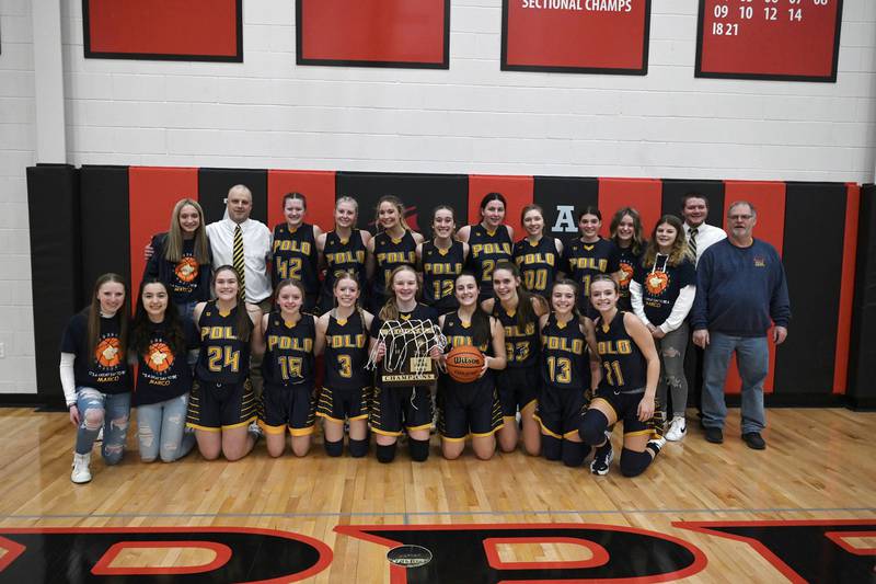 The Polo girls basketball team poses with the Class 1A regional plaque Friday night in Amboy.