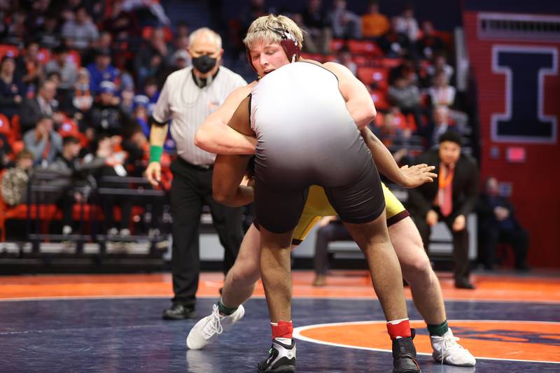Lockport’s Andrew Blackburn-Forst looks to drop Marist’s Ghee Rachal in the Class 3A 220lb. championship match at State Farm Center in Champaign. Saturday, Feb. 19, 2022, in Champaign.
